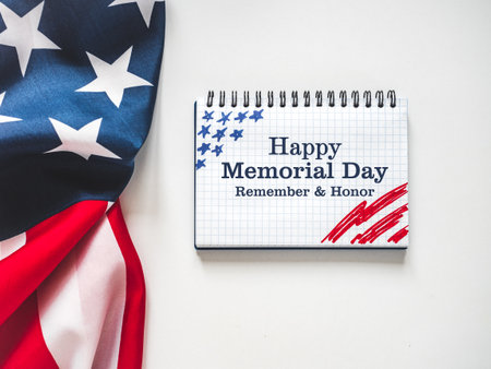 Memorial Day. American Flag and congratulatory inscription. No people. Closeup, top view. National holiday concept. Congratulations for family, relatives, friends and colleaguesの写真素材