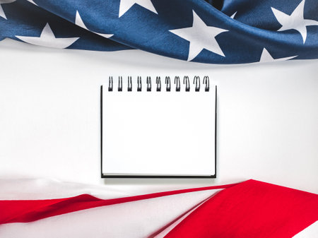 American Flag on white background and space for Your congratulatory inscription. Greeting card. Studio shot. Congratulations for family, loved ones, relatives, friends and colleaguesの写真素材