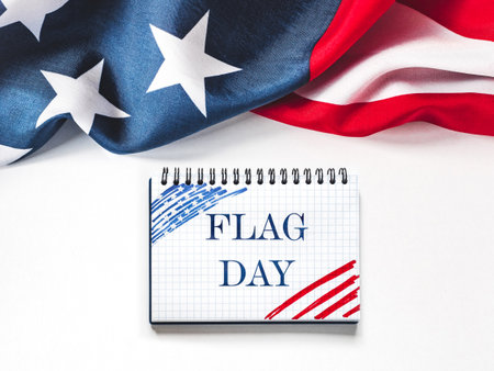 Happy Flag Day. American Flag and congratulatory inscription. No people. Closeup, top view. National holiday concept. Congratulations for family, relatives, friends and colleaguesの写真素材