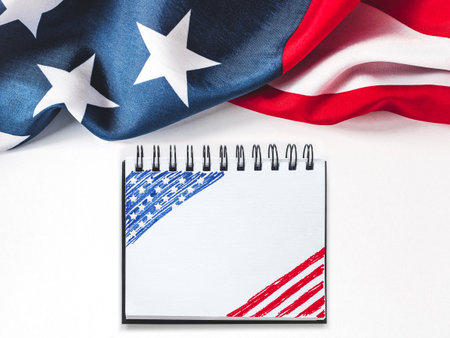 American Flag on white background and space for Your congratulatory inscription. Greeting card. Studio shot. Congratulations for family, loved ones, relatives, friends and colleaguesの写真素材