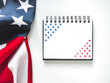 American Flag on white background and space for Your congratulatory inscription. Greeting card. Studio shot. Congratulations for family, loved ones, relatives, friends and colleaguesの写真素材