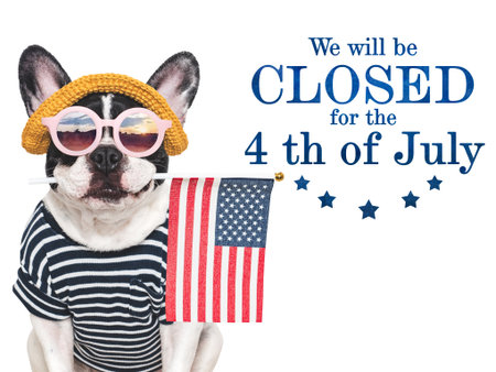 Signboard with the inscription We will be closed for the 4th of July. Cute puppy. Closeup, indoors. Studio shot. Congratulations for family, loved ones, friends and colleagues. Pets care conceptの写真素材