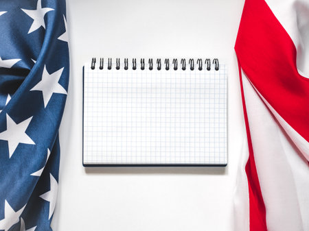 American Flag on white background and space for Your congratulatory inscription. Greeting card. Studio shot. Congratulations for family, loved ones, relatives, friends and colleaguesの写真素材