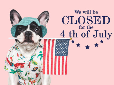 Signboard with the inscription We will be closed for the 4th of July. Cute puppy. Closeup, indoors. Studio shot. Congratulations for family, loved ones, friends and colleagues. Pets care conceptの写真素材
