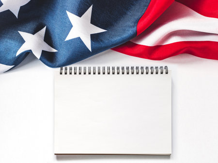 American Flag on white background and space for Your congratulatory inscription. Greeting card. Studio shot. Congratulations for family, loved ones, relatives, friends and colleaguesの写真素材