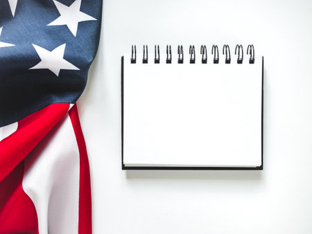 American Flag on white background and space for Your congratulatory inscription. Greeting card. Studio shot. Congratulations for family, loved ones, relatives, friends and colleaguesの写真素材