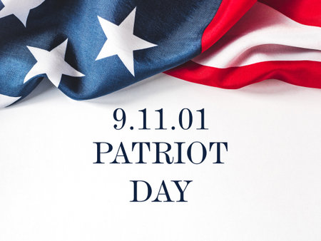 Patriot Day. We will never forget. American flag and lettering. Closeup, isolated background. Studio shot. No peopleの写真素材