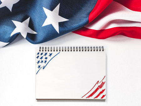 American Flag on white background and space for Your congratulatory inscription. Greeting card. Studio shot. Congratulations for family, loved ones, relatives, friends and colleaguesの写真素材