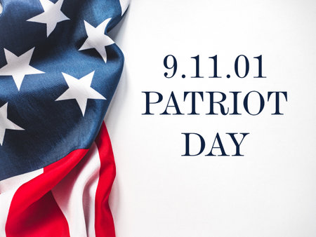 Patriot Day. We will never forget. American flag and lettering. Closeup, isolated background. Studio shot. No peopleの写真素材