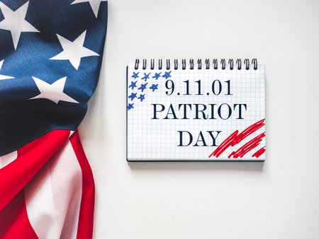 Patriot Day. We will never forget. American flag and lettering. Closeup, isolated background. Studio...