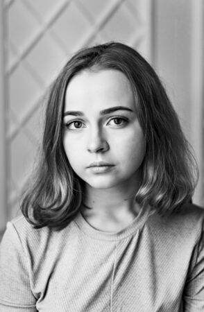Close-up portrait of a young girl. Black and whiti photo.の写真素材