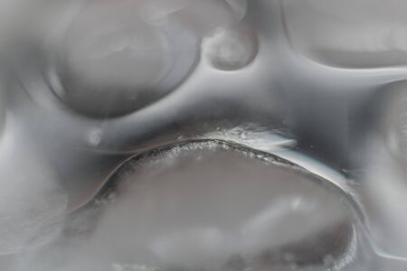 Blurred background with ice cubes in a glass. Abstract Christmas backgroundの写真素材
