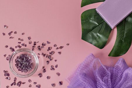 Natural organic cosmetic products with Monstera leaves on a pink background. Flat lay, top view, copy space. The concept of skin care and beauty. Spa home.の写真素材