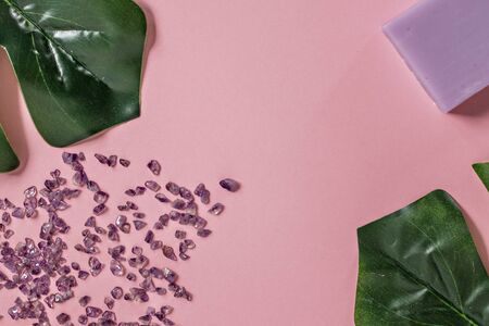 Natural organic cosmetic products with Monstera leaves on a pink background. Flat lay, top view, copy space. The concept of skin care and beauty. Spa home.の写真素材
