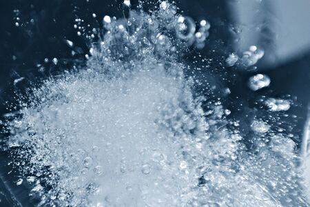 Blurred background of ice in a glass. Abstract Christmas background