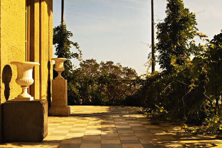 Terrace with ancient vases and greenery.