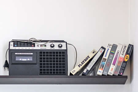Vintage cassette recorder and videotapes on the shelfのeditorial素材