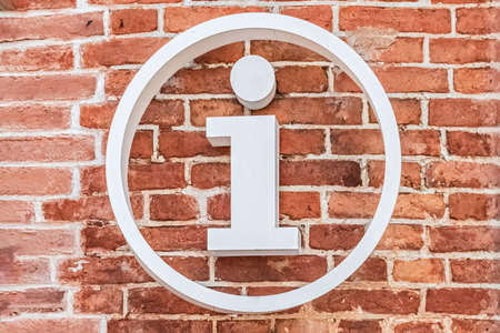 Gold womens shoes on a red velvet chair, in a classic style. The inscription in English on the window DOLCE GABANNAのeditorial素材