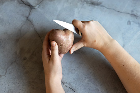 Two rattan hearts pink and blue on a snow-covered tree trunk. The concept of Valentine's day.の写真素材