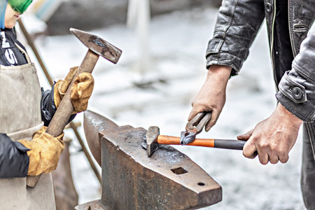 Two rattan hearts pink and blue on a snow-covered tree trunk. The concept of Valentine's day.の写真素材