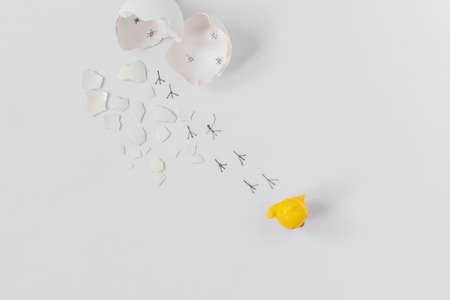 White eggshell of a broken chicken egg with shards and footprints of a chick isolated on a white background.Easter.の写真素材