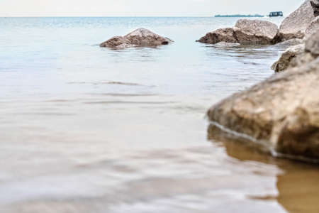 Granite stones in the water on the shore of the Gulf of Finlandの写真素材