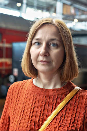 Portrait of a young woman at the railway station. Tourism.の写真素材