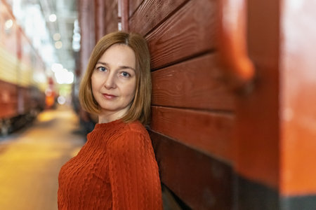 A young woman at the railway stationの写真素材