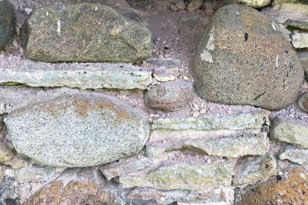 The stone wall of an ancient fortress. Background