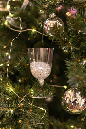 Christmas background from a Christmas tree decorated with New Year's toys on the street. Snow, winter holidays.の写真素材