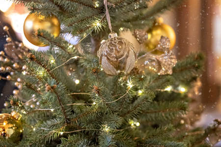 Christmas background from a Christmas tree decorated with New Year's toys on the street. Snow, winter holidays.の写真素材