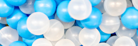 The background is made of plastic whites. Blue balls in the playroom.Bannerの写真素材