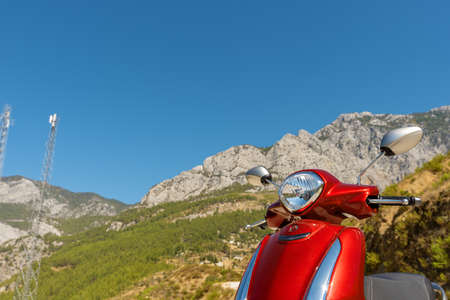 Red scooter in the mountains of southern Turkey near Alanya.の写真素材