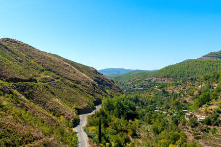 An old asphalt road through a valley from above in southern Turkey leading to Sapadere Kanyen.