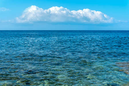 Mediterranean Sea in Turkey, Alanya. Beautiful calm turquoise water and blue sky with small clouds.の写真素材