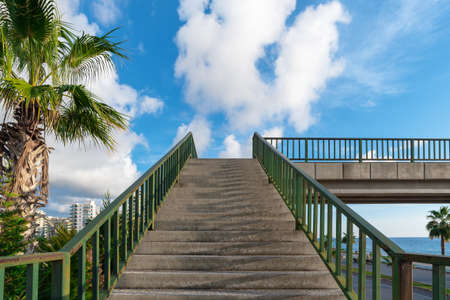 A pedestrian crossing staircase rises into the sky in Alanya, Turkey.の写真素材