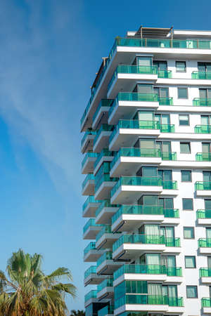 View of the corner of a tall building in a southern Turkish city. vertical shot.の写真素材