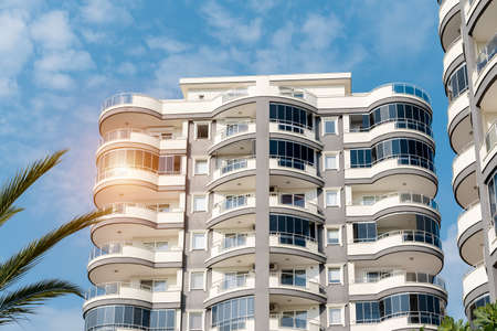 Low angle view of an apartment building with balconies. residential real estate.の写真素材