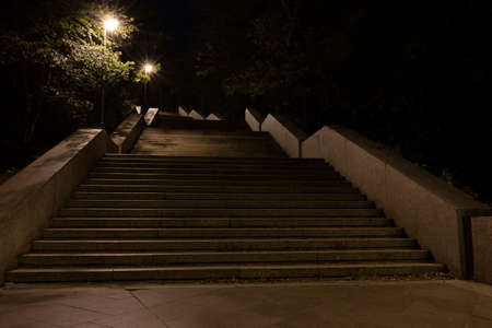 lit street light in a city street at night. glowing lamp at night in the old town of prague in the czech republicの写真素材