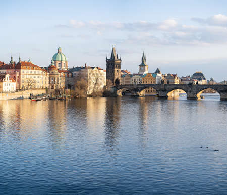 view of Charles Bridge and the Vltava River in the center of Prague before sunsetの写真素材