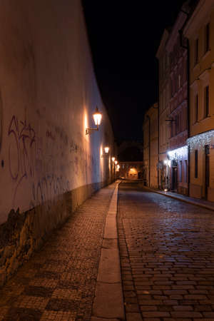 panoramic view of Charles Bridge on the Vltava river and in the background Prague Castle and St. Vitus Cathedral in the center of Prague in the eveningのeditorial素材