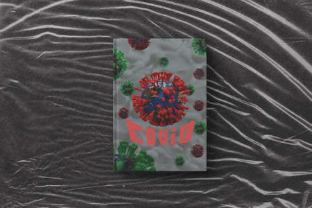 3d illustration of book with virus inscription and logo on color textureの写真素材