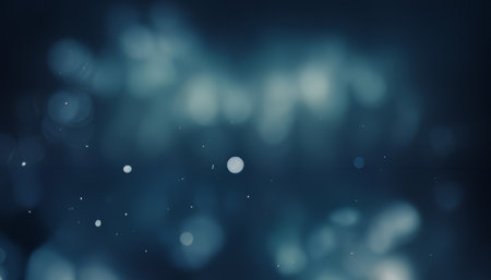 Falling snowflakes in freezing temperatures with a blue backgroundの写真素材