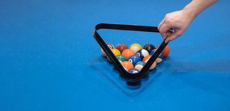 Multicolored billiards, billiard balls on a blue table, colored balls on a billiard table, Russian...