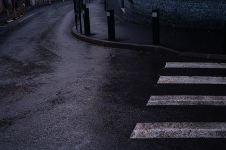 pedestrian crossing in dark colors in rainy weather