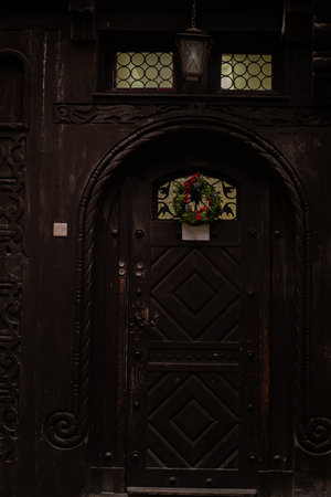 Romania, Brasov Old wooden door at one of the entrances to the church in the Gothic styleの写真素材