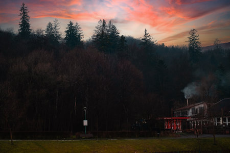 recreation area in the mountains, tall trees, mountains, at nightの写真素材