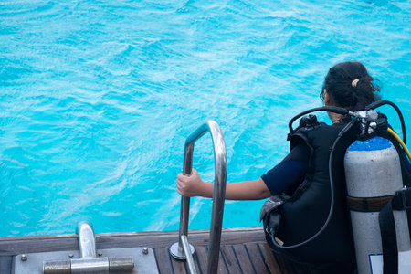 Scuba diver before diving. Diving lesson in open water.の写真素材