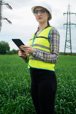 electrical engineer woman high voltage power industry, electrician worker working, energy concept,...