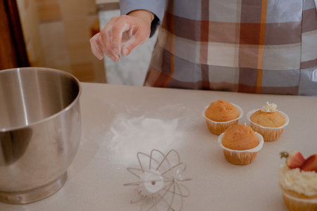 A female pastry chef prepares dough, sprinkling flour, showcasing homemade baking. Explore the charm...